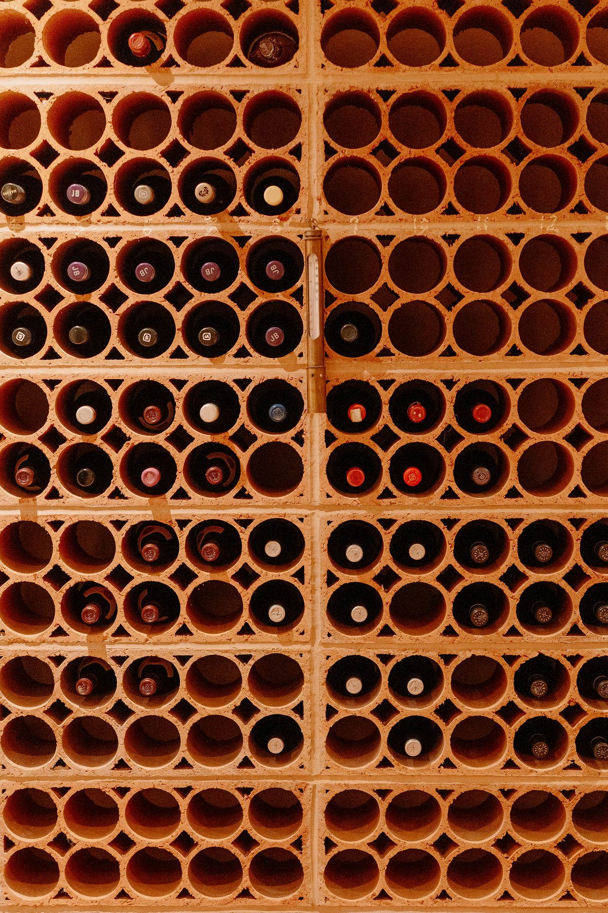 Professional detail of the illuminated wine wall in the cellar