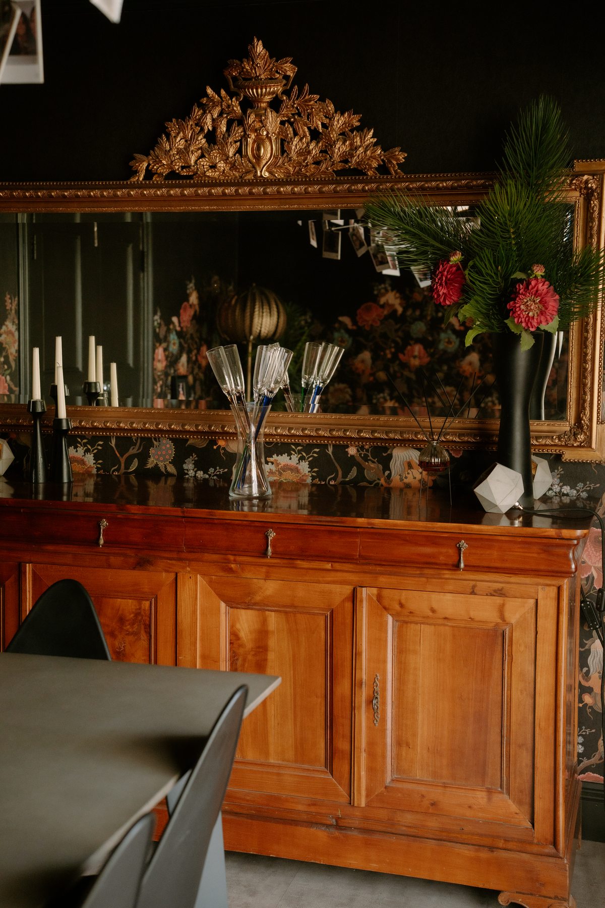 Antique cabinet and flowers in the dining room