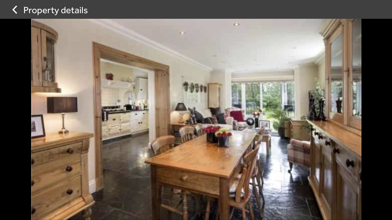 The original kitchen and dining room divided by a wide doorway