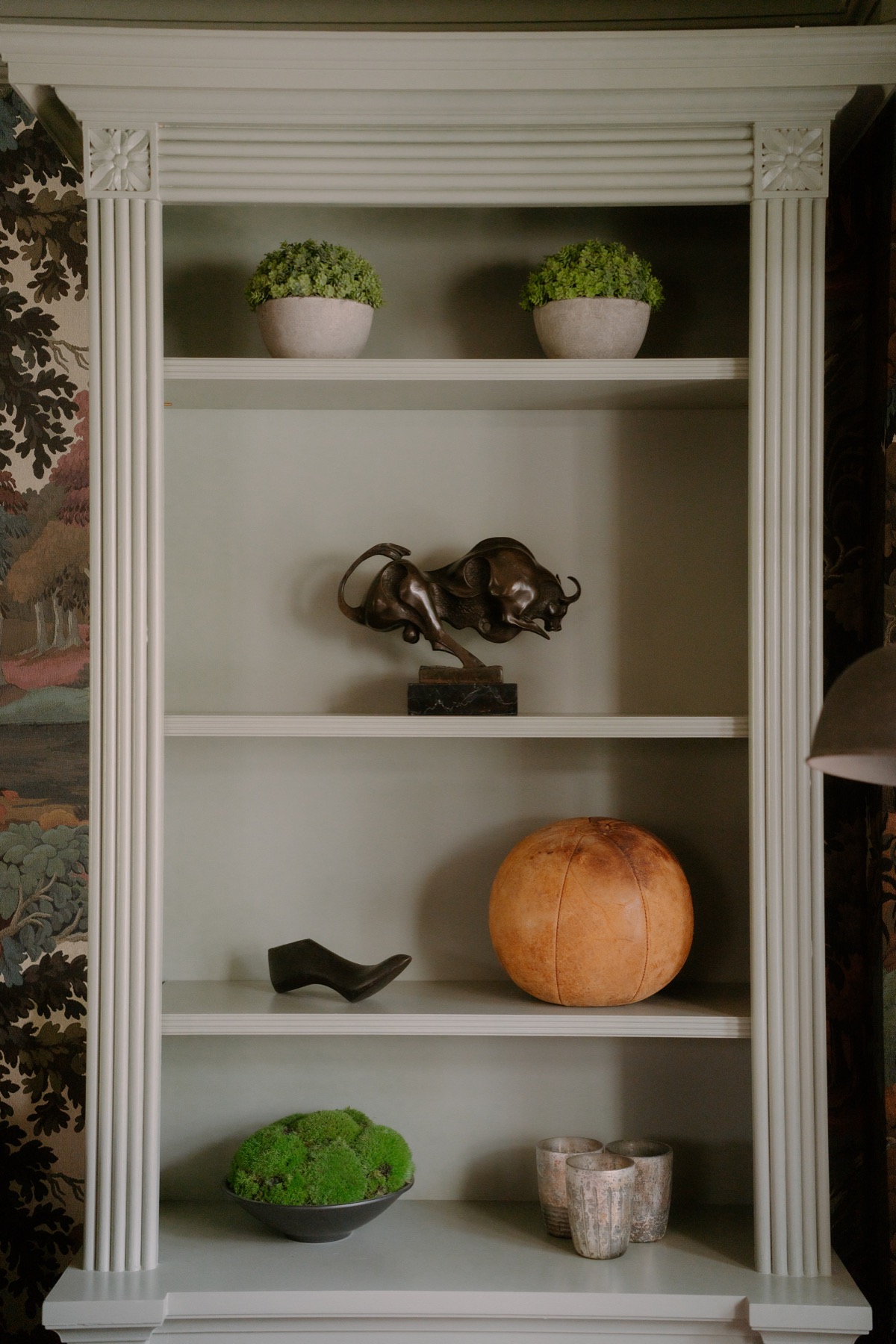 Styled shelving in the patterned lounge